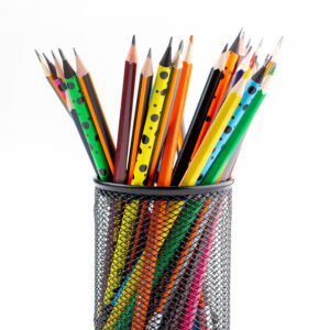 graphite-drawing-pencils-bright-lined-inside-black-basket-white-desk
